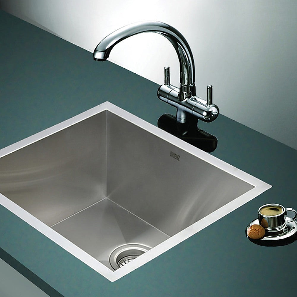 Stainless steel laundry sink with chrome faucet and round drain strainer