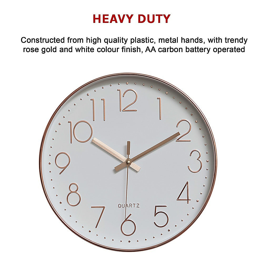 Rose gold wall clock with white face, roman numerals, and metal hands with dot markers