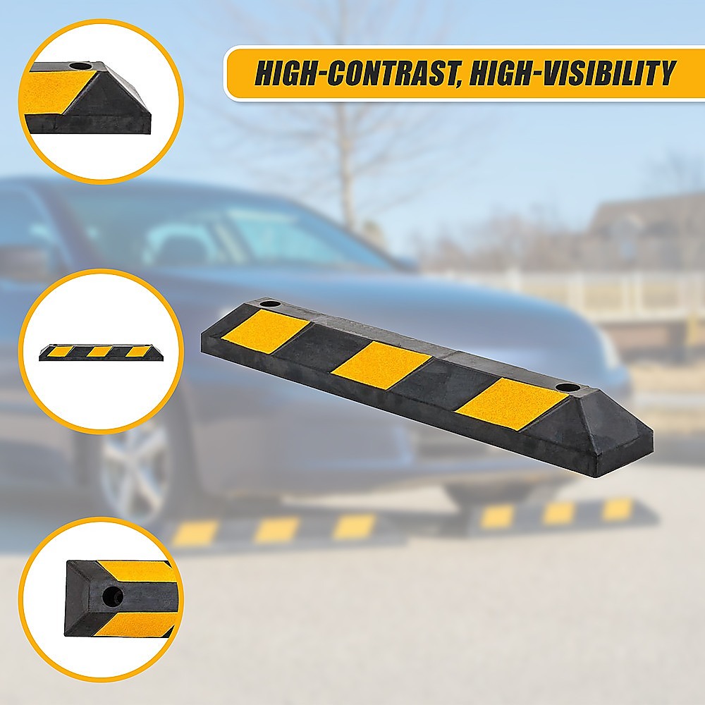 Black rubber wheel stop with yellow reflective pads, shown in angled perspective