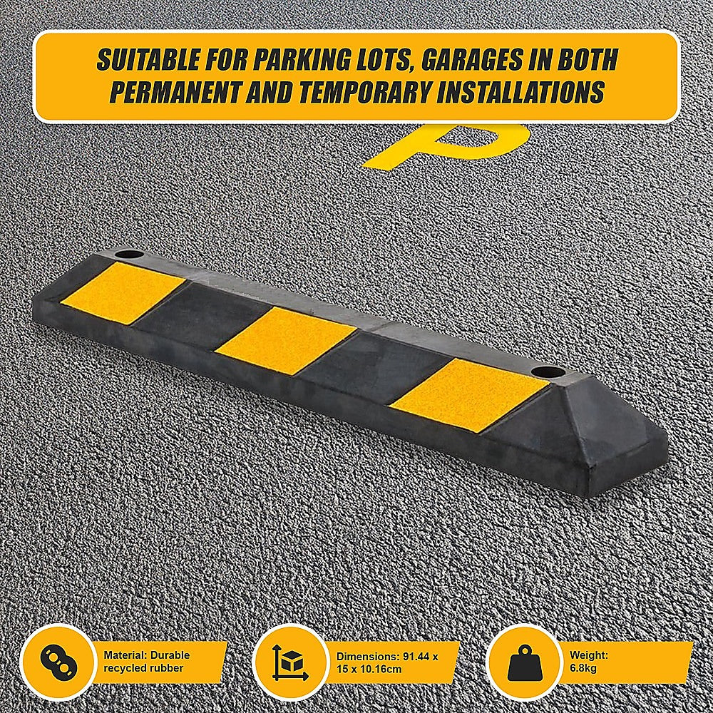 Black rubber wheel stop with yellow reflective pads and two top mounting holes