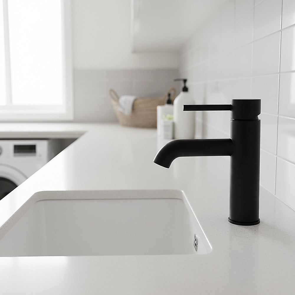 Matte black basin mixer tap with curved spout and tall cylindrical body