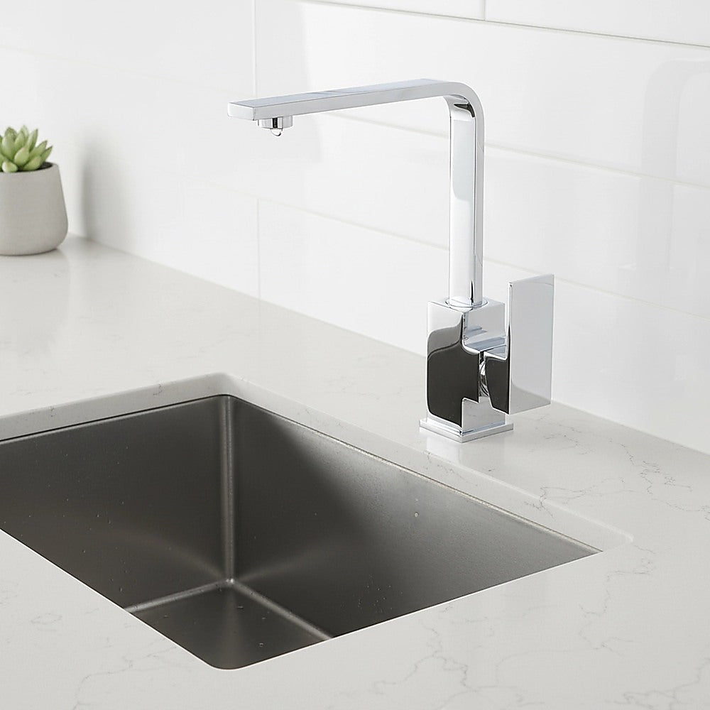 Chrome mixer tap faucet over undermount sink with tall curved spout and square handle