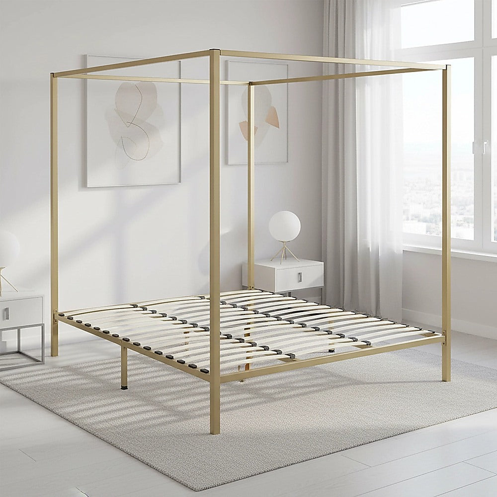 Four-poster king bed frame with gold posts and slatted platform deck.