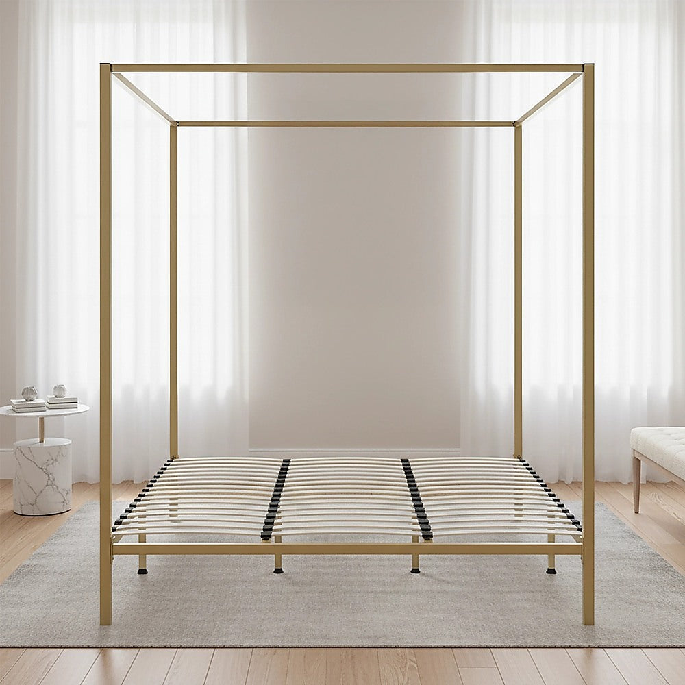 Four-poster king bed frame with gold metal top rails and slatted mattress base