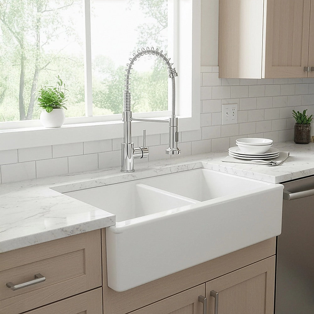 Kitchen sink faucet with tall arched neck and pull-down sprayer, chrome