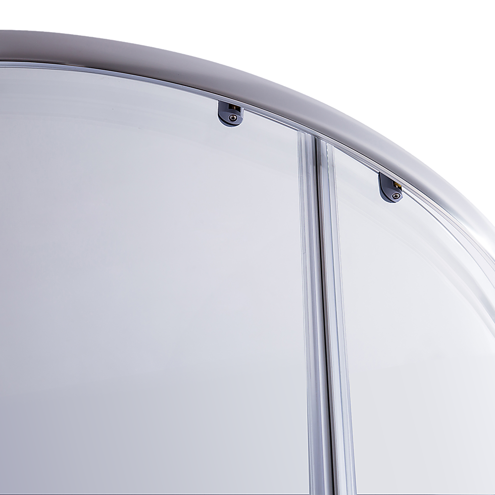 Curved chrome top rail with glass panel brackets on rounded shower enclosure