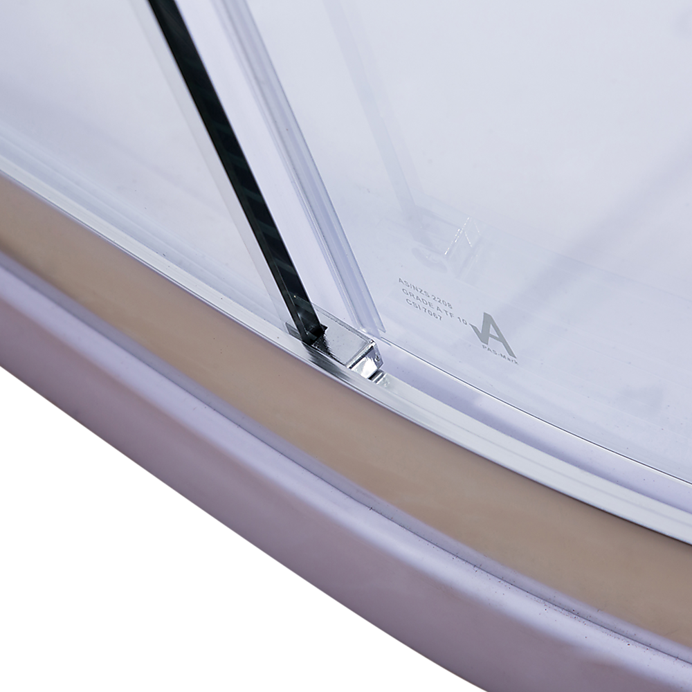 Curved bottom track and glass edge on chrome shower enclosure