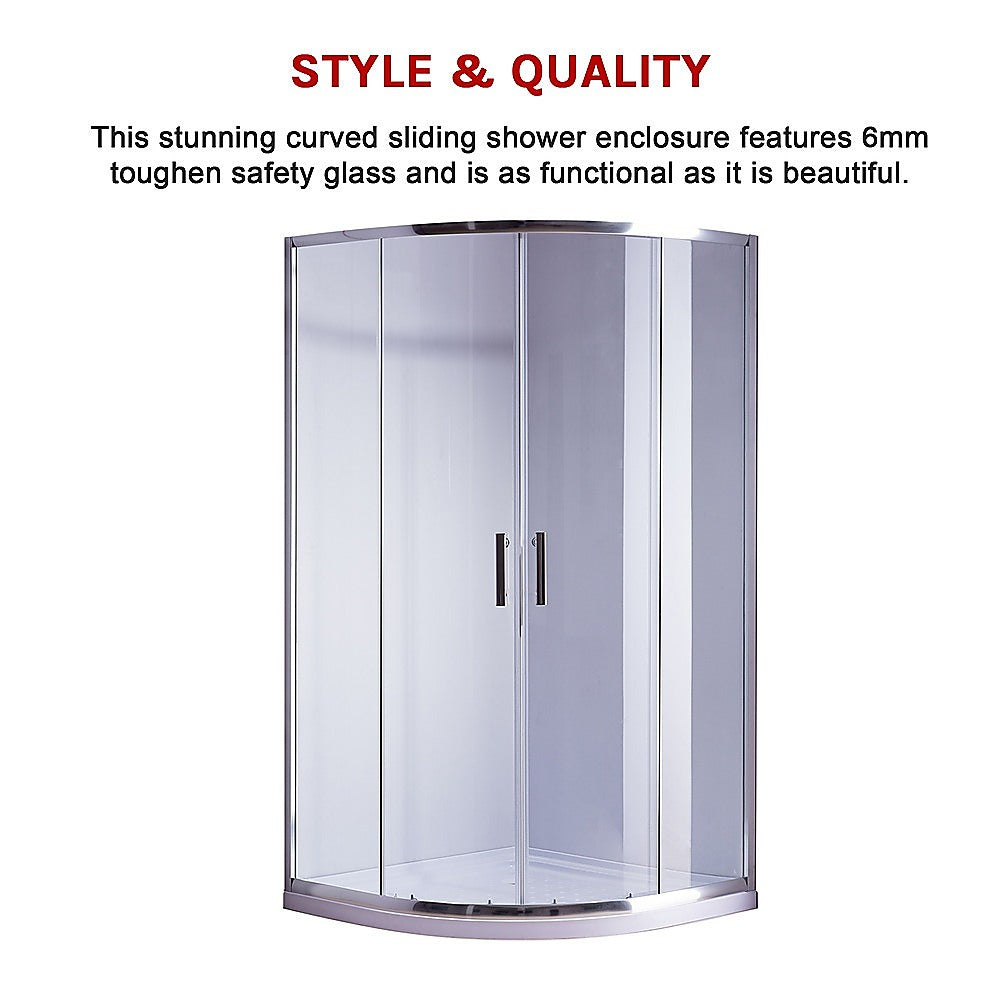 Rounded sliding shower enclosure with clear glass and chrome frame, curved base
