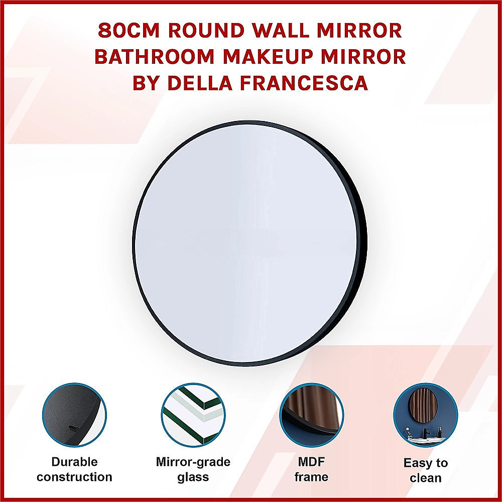 Round wall mirror with dark rim and reflective glass, wall-mounted.