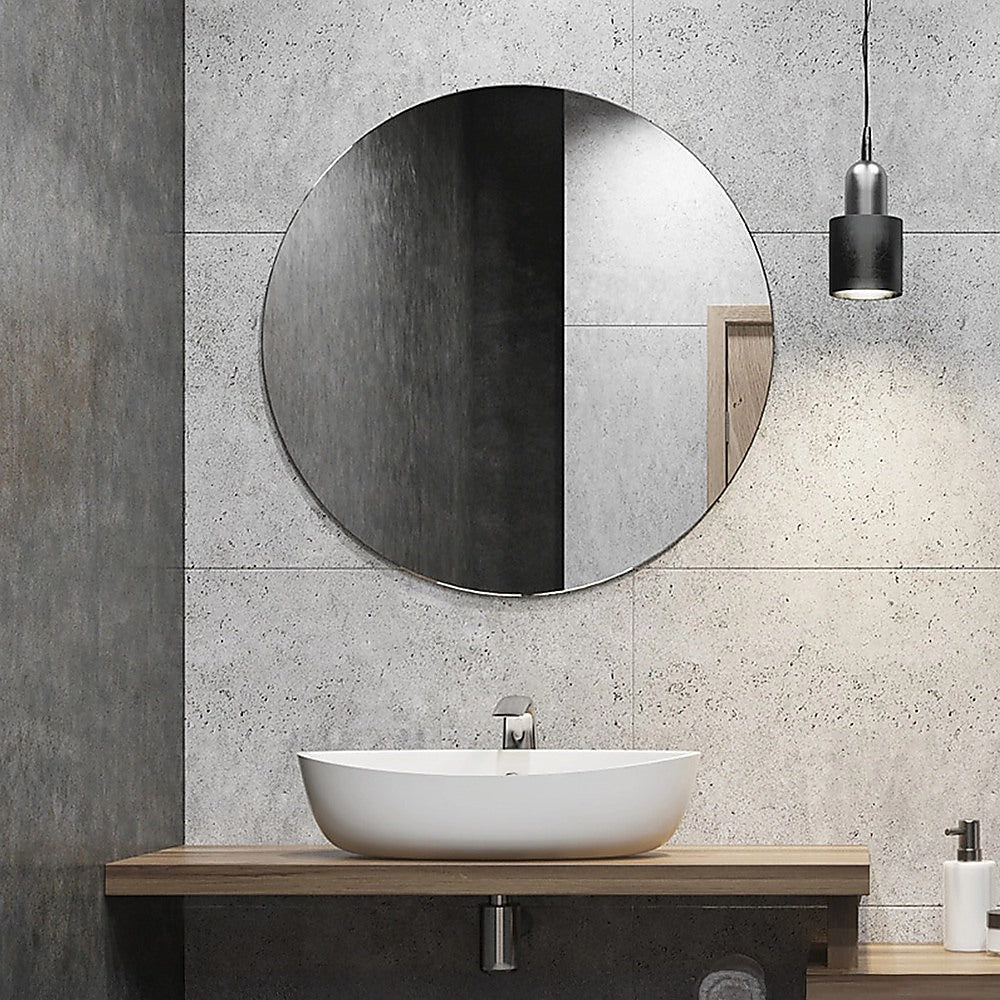 Round wall mirror with dark rim and mirror-like reflective glass.