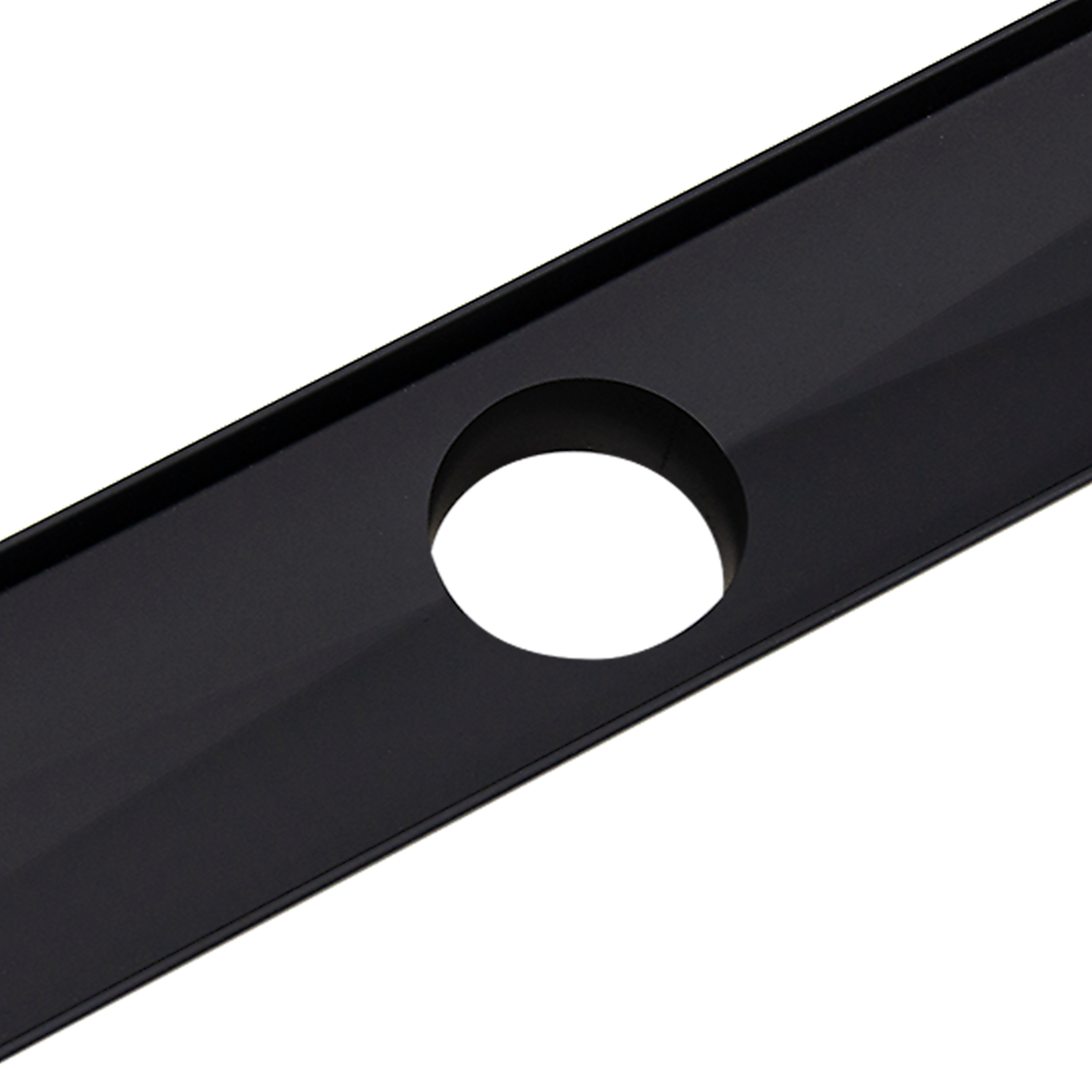 Black shower drain grate with round center outlet