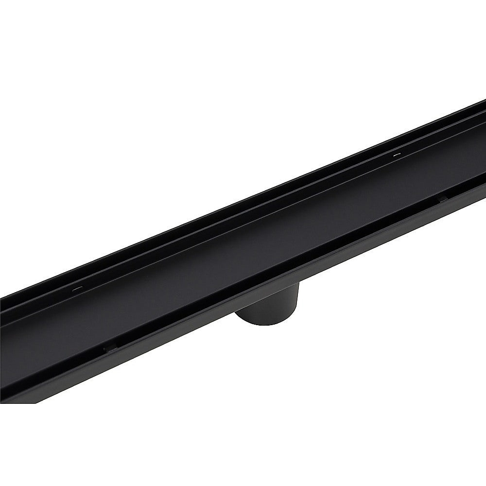 Black shower drain grate with side slot and outlet protrusion