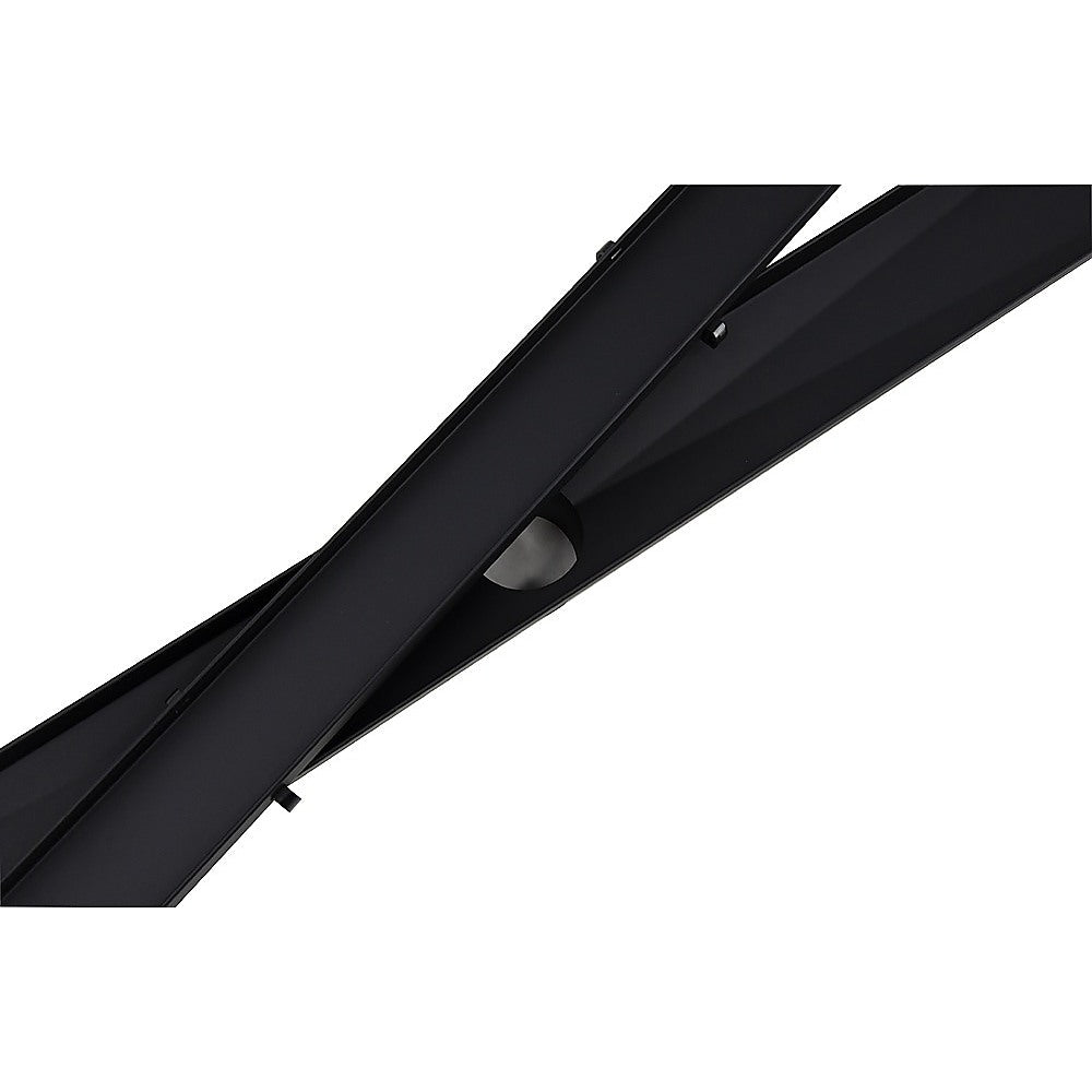 Black linear shower drain insert with circular center opening and channel slot.