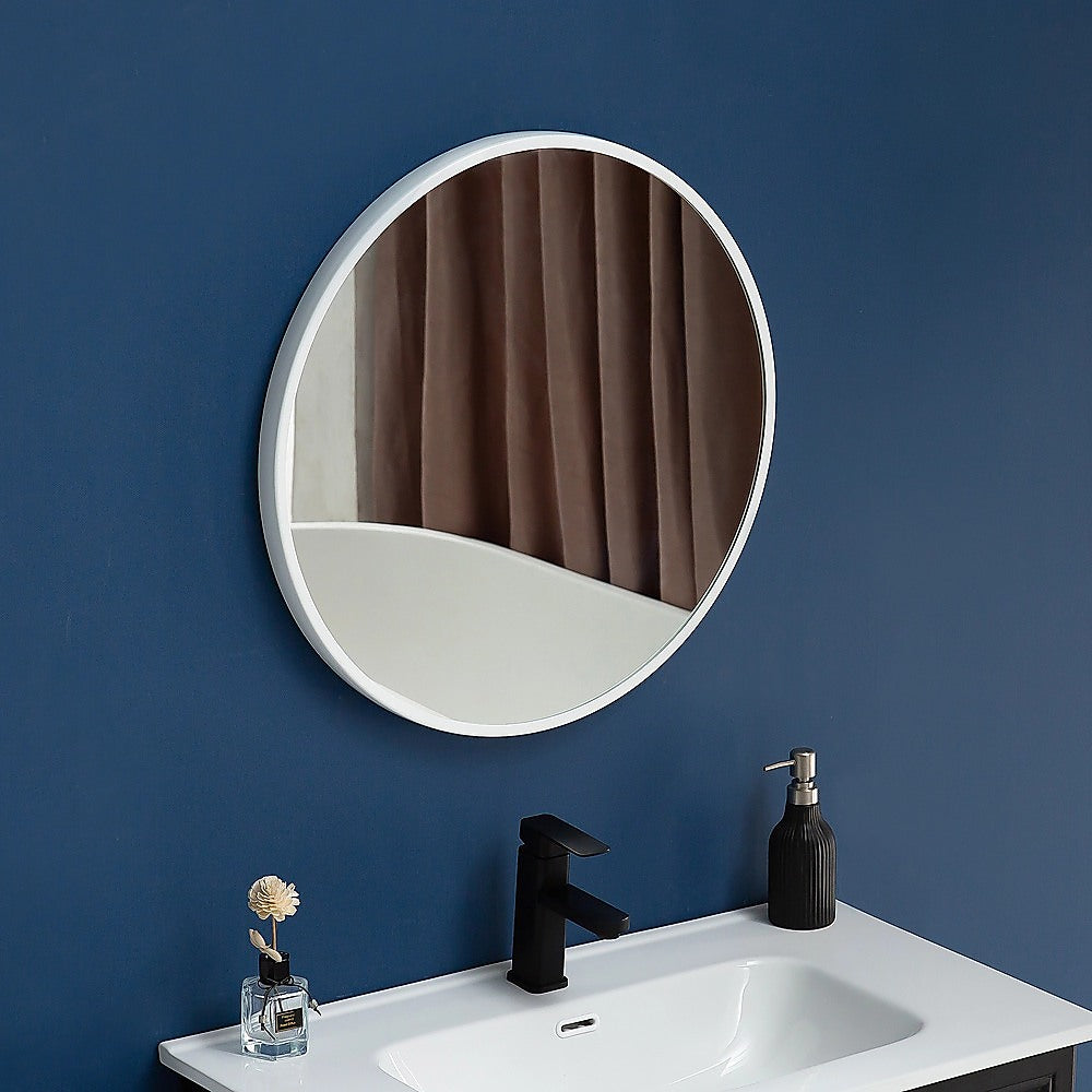 Round wall mirror with slim white frame and clear reflective glass