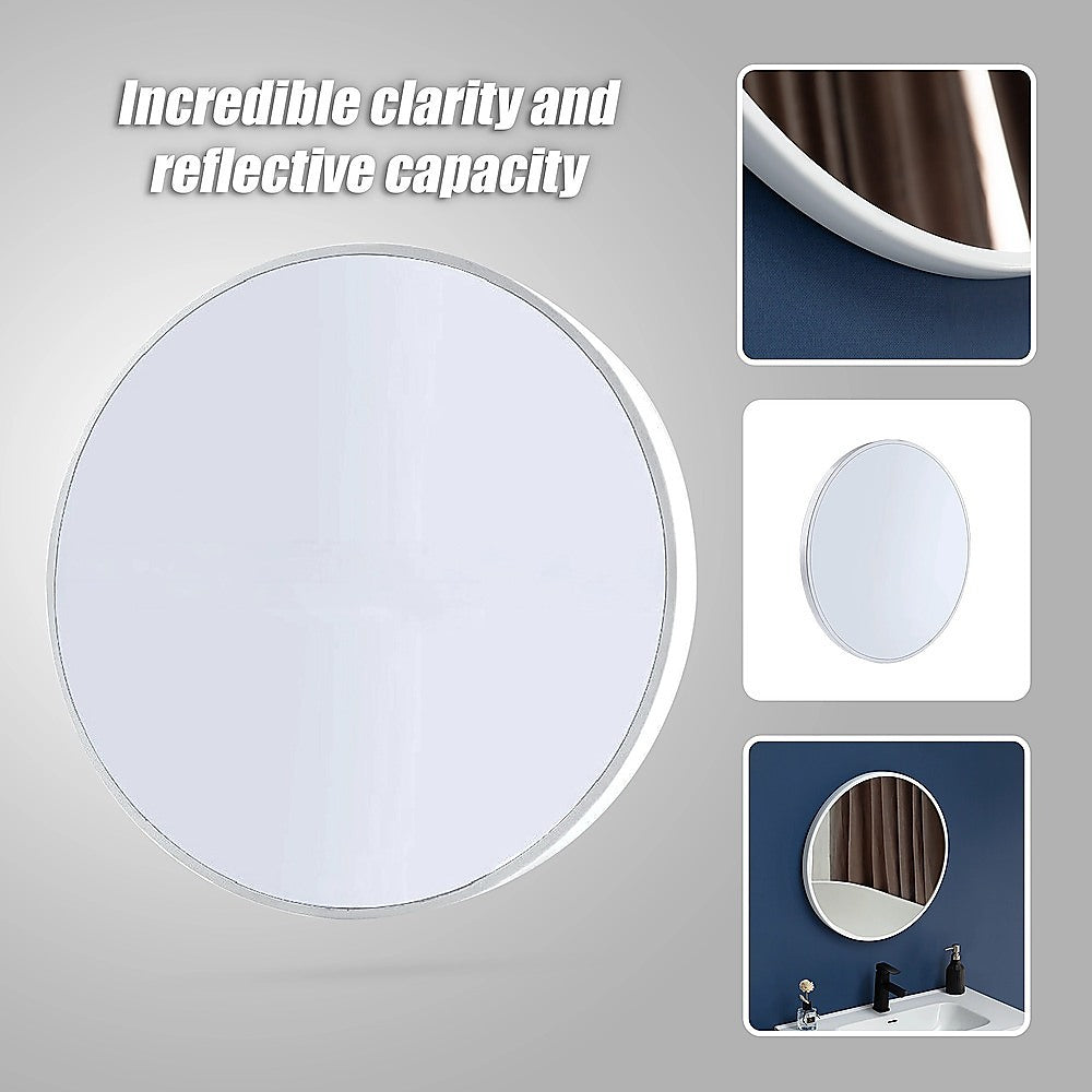 Round wall mirror with white frame and reflective glass, detail view