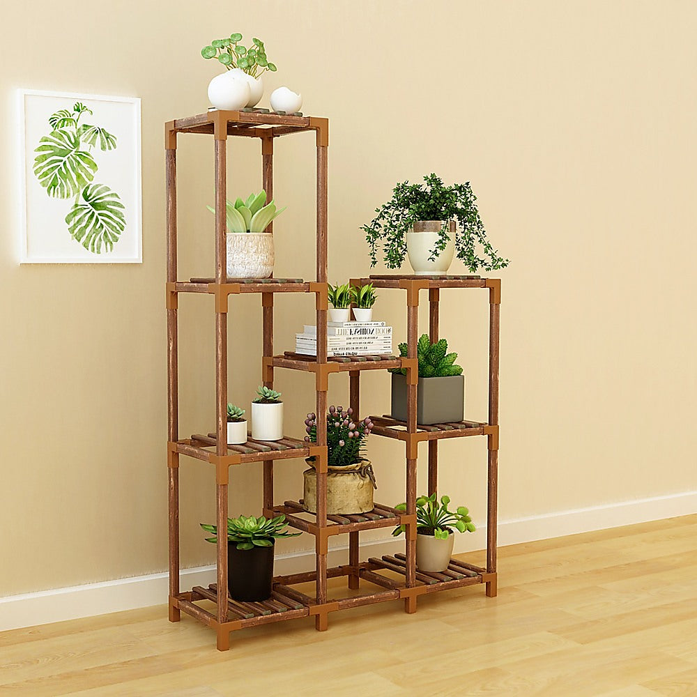 Wooden plant stand with 9 shelves holding potted plants and planters
