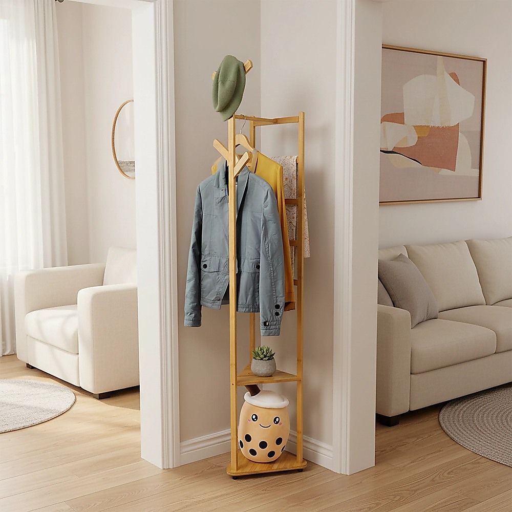 Wooden coat rack with hanging jacket and cap above lower storage basket