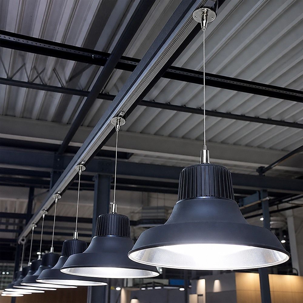 Multiple stainless steel suspension cables and hooks holding ceiling lights