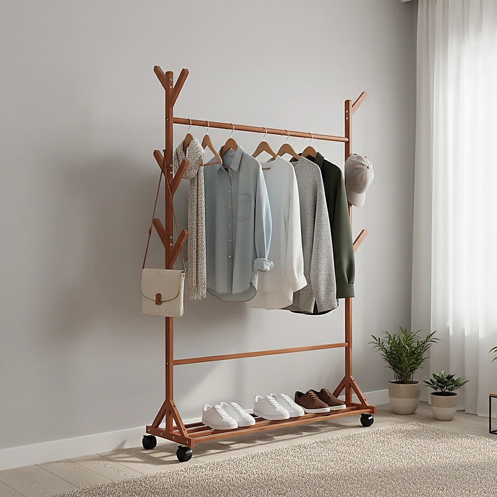 Bamboo clothes rack holding hanging coats, shoes, and bags on shelves