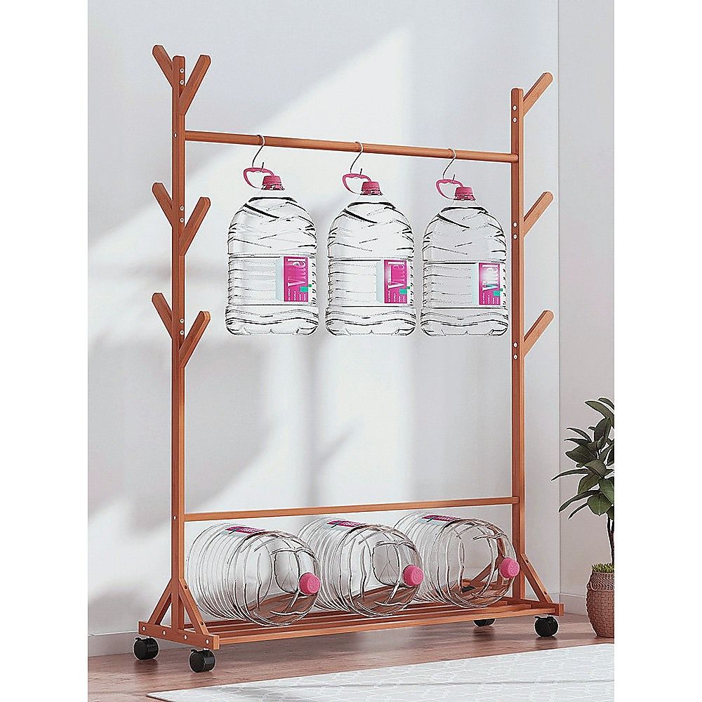 Bamboo clothes rack with hanging bottles and bottom shelf storage
