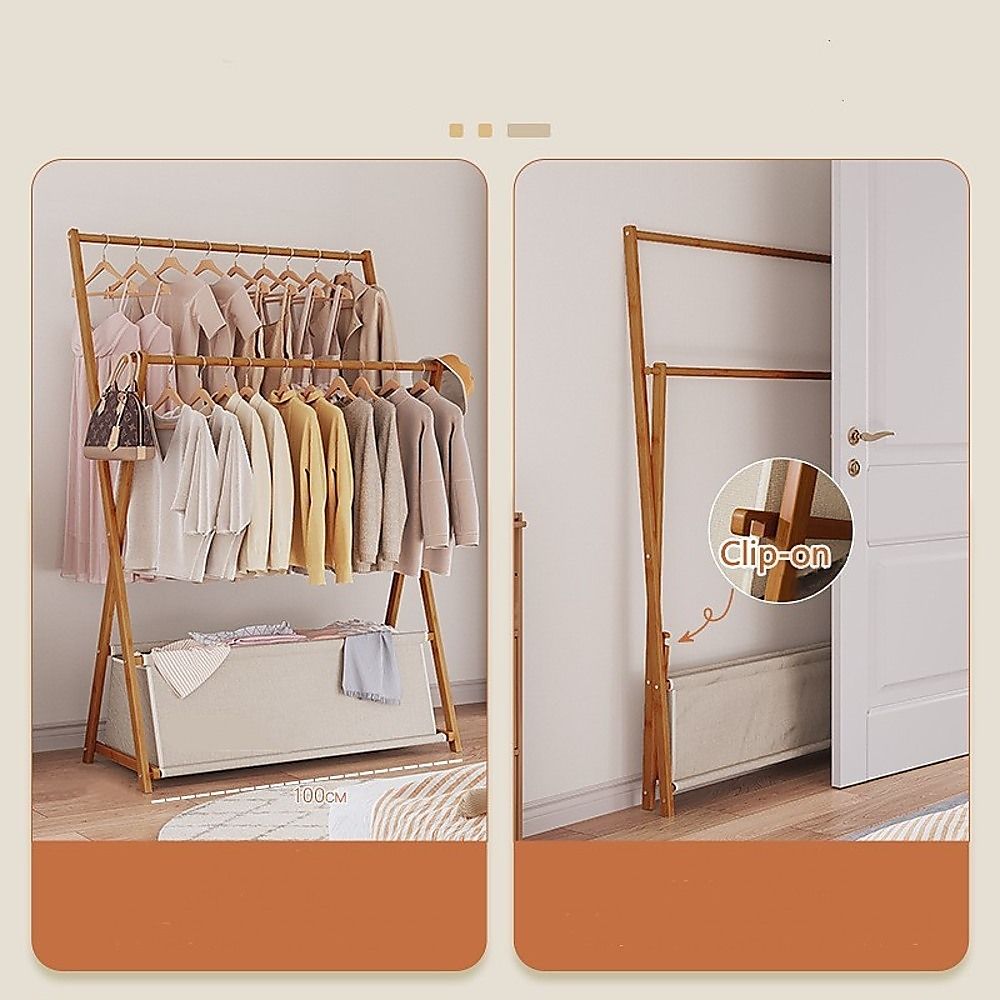 Dark wood garment rack with hanging clothes and lower fabric storage shelf
