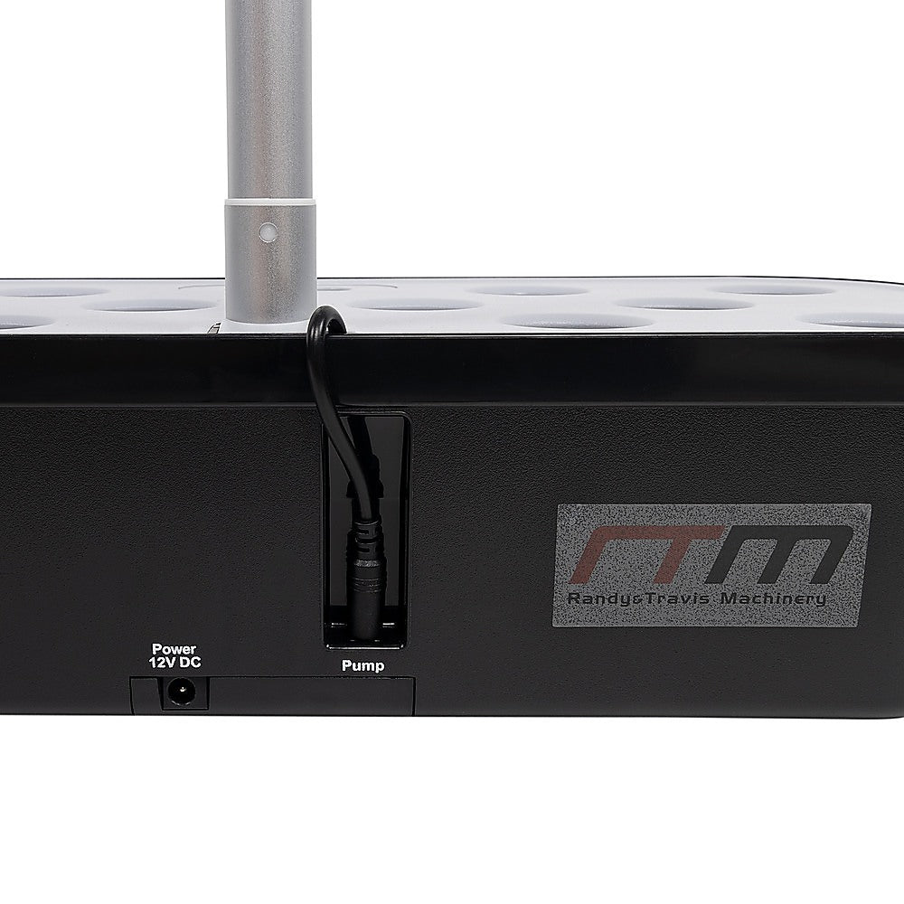 Indoor hydroponic germination system pump and power ports on black base, tube attachment