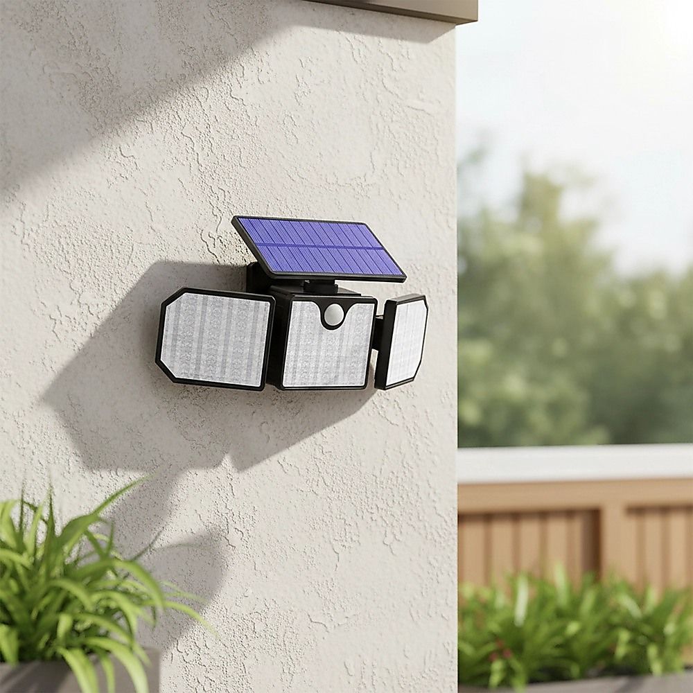 Wall-mounted solar LED security light with motion sensor, three panel heads on exterior wall
