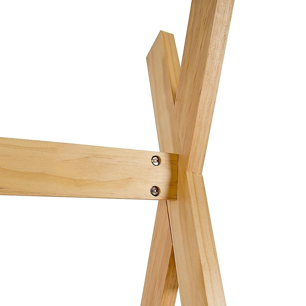 Close-up of wooden bed frame joint with screws and smooth pine finish