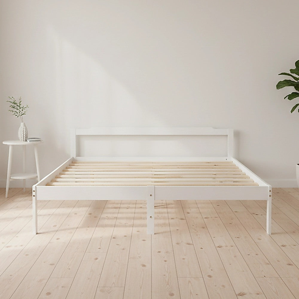White double bed frame with slatted wooden base and footboard