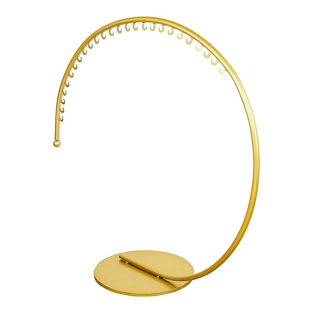 Curved floor-standing clothes hanger rack with gold bar and hook row
