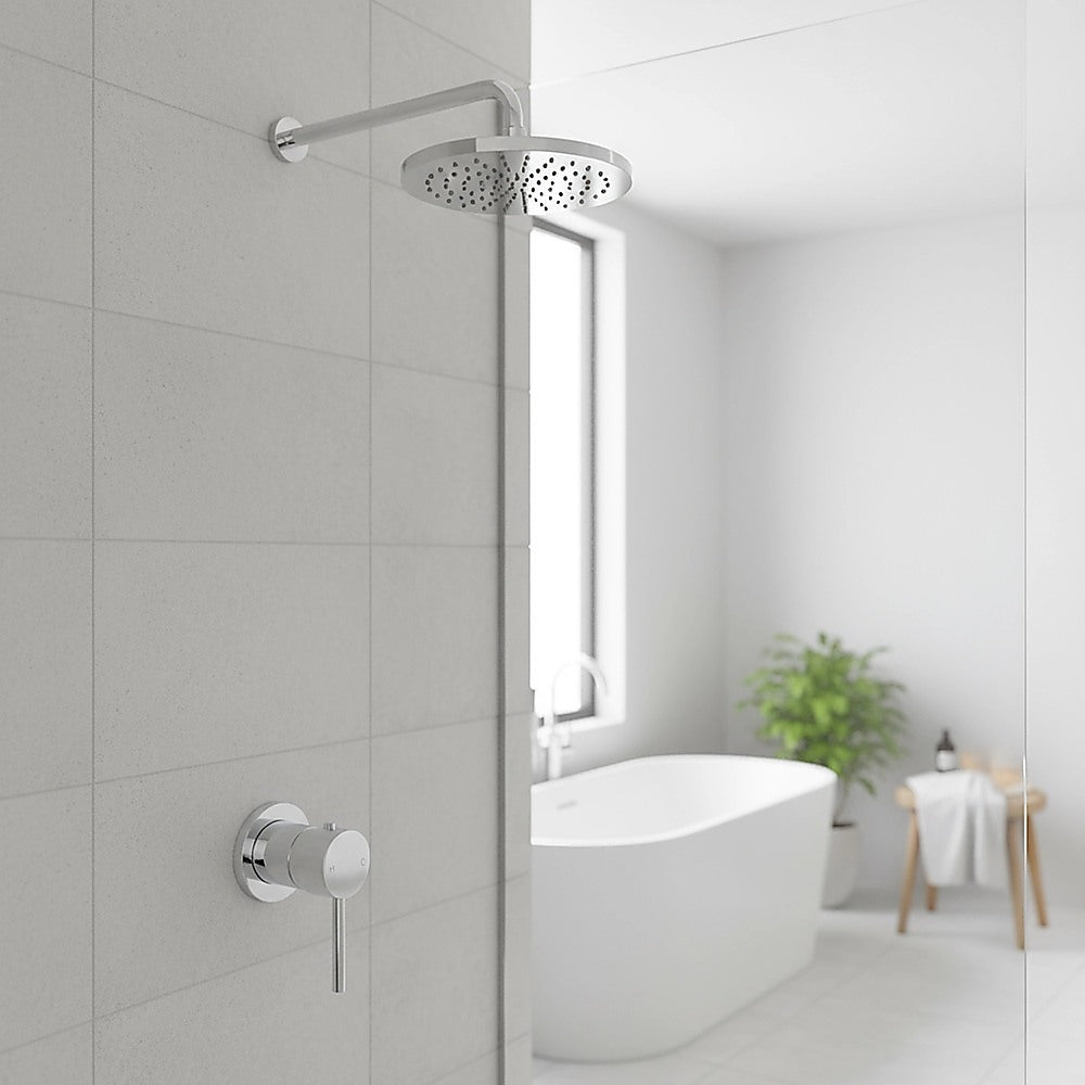 Shower bath mixer tap on wall beside an overhead rain shower head