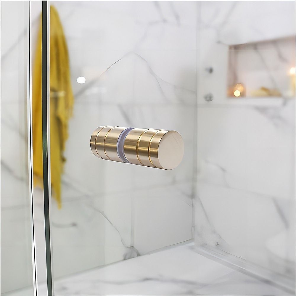 Gold round knob handle with SS hinge hardware on frameless shower glass panel