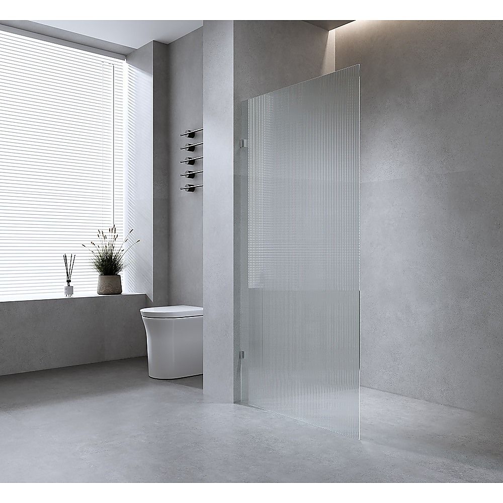 Reeded glass shower screen panel with black F-brackets, corner-mounted