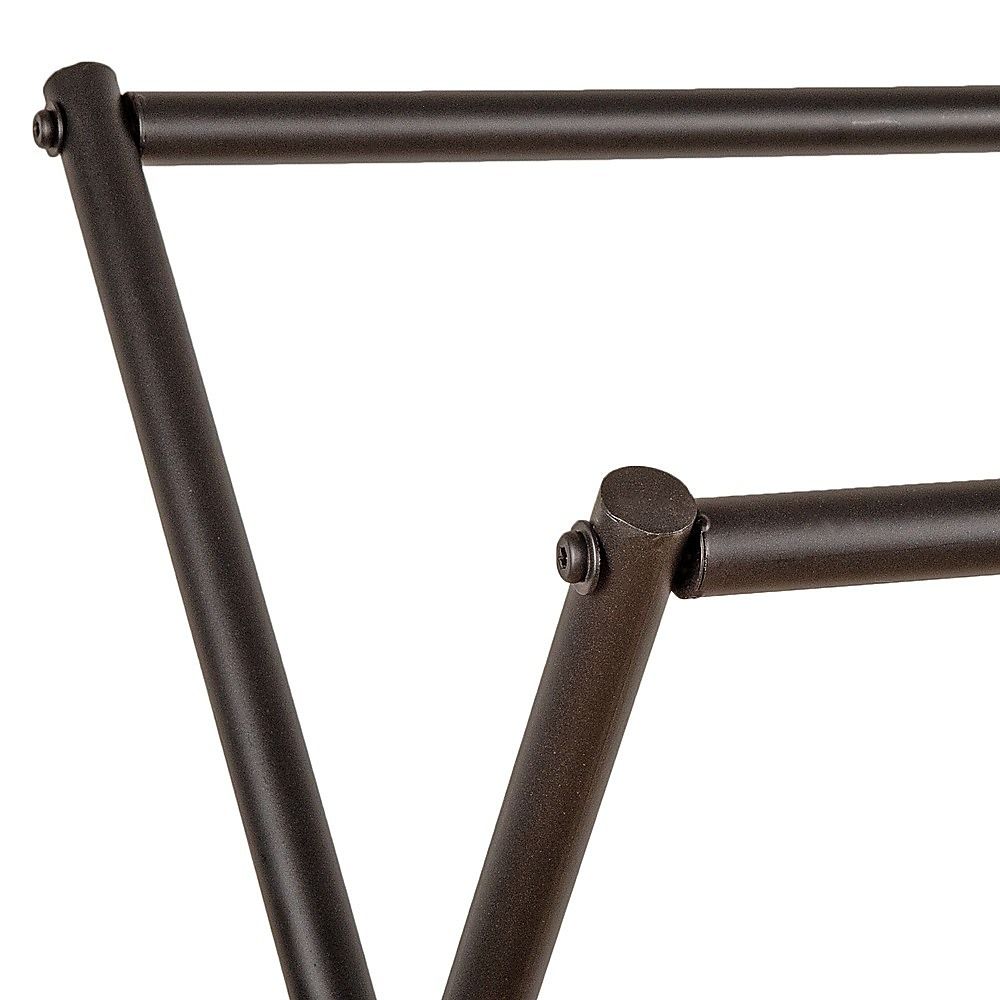 Close-up of black metal garment rack leg with welded elbow joint