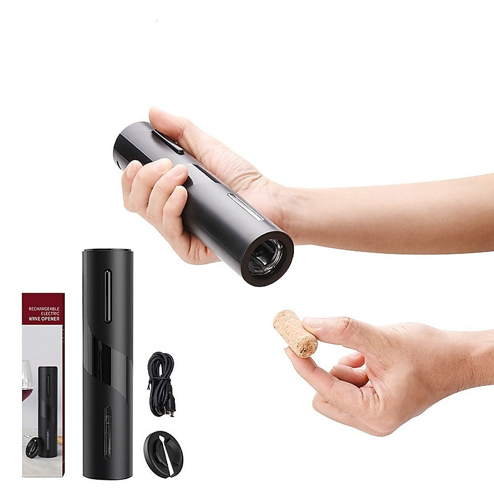 Electric wine bottle opener held in hand, black cylindrical design