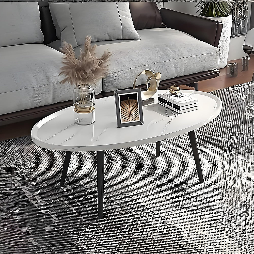 Oval marble-look coffee table with white top and black tapered legs