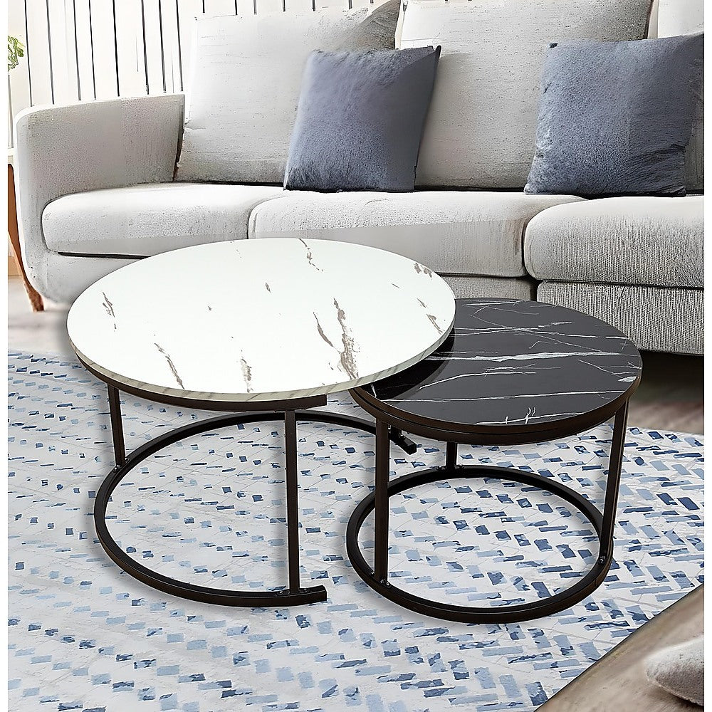 Round marble nesting coffee table set with white and dark gray tops, black metal frame.