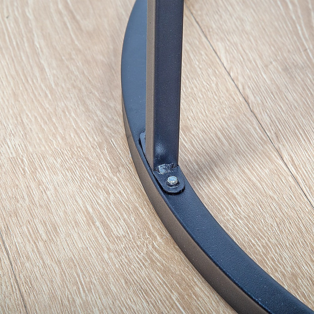 Black metal support leg with screw detail for a round marble nesting side table.