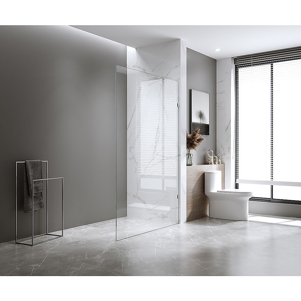 Frameless glass shower screen with black brackets, shown in bathroom doorway view