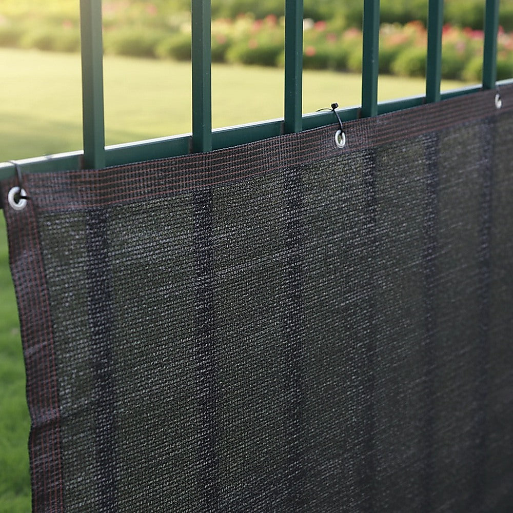Black mesh privacy screen panel with hanging loops and reinforced top border