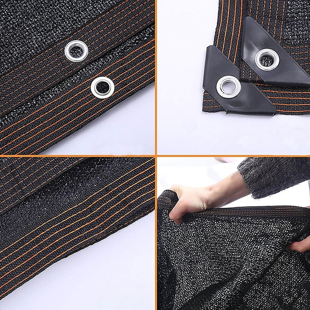 Black mesh privacy screen corner with metal grommets and stitched border trim
