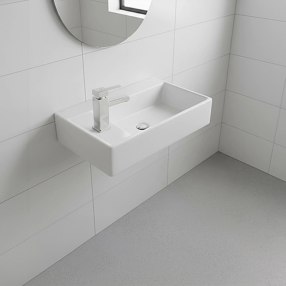 Wall-hung ceramic hand wash basin with tall mixer tap, rectangular bowl in white