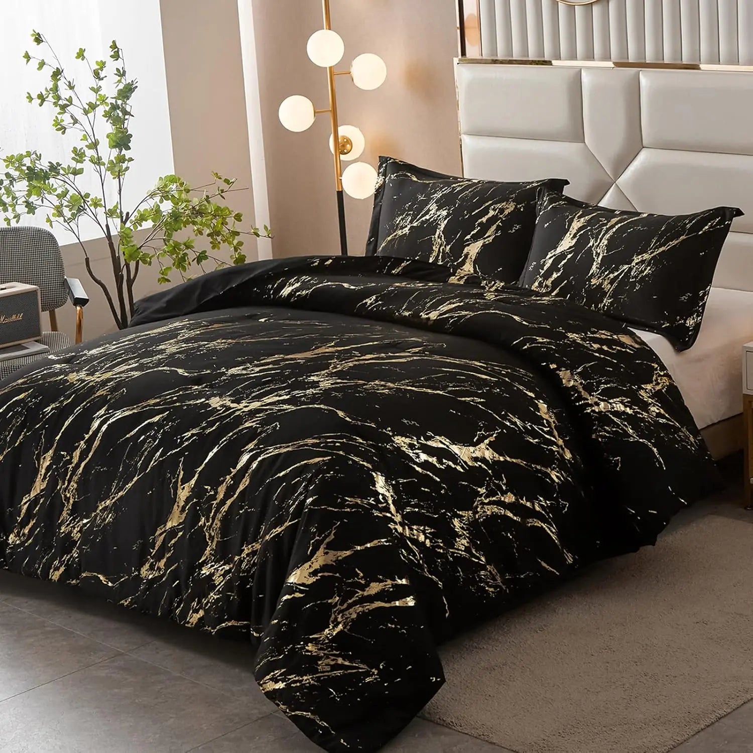 King comforter set with black bedding and gold metallic marble print, including two pillows