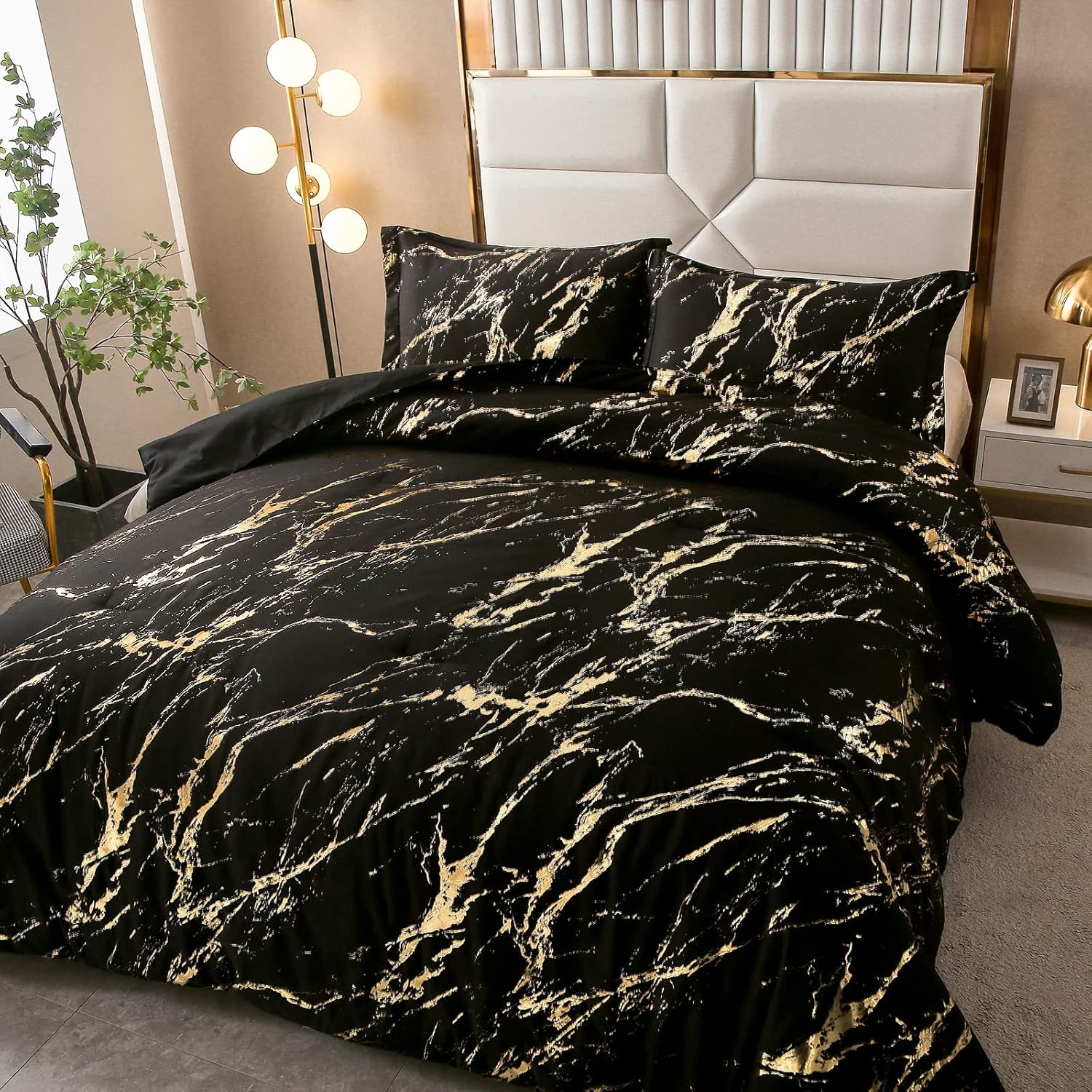King comforter set on bed with black fabric and gold marble foil pattern, two shams