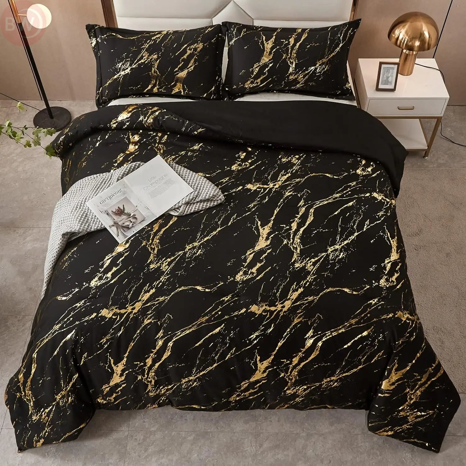 Black king comforter set with gold metallic marble print and two matching pillow shams