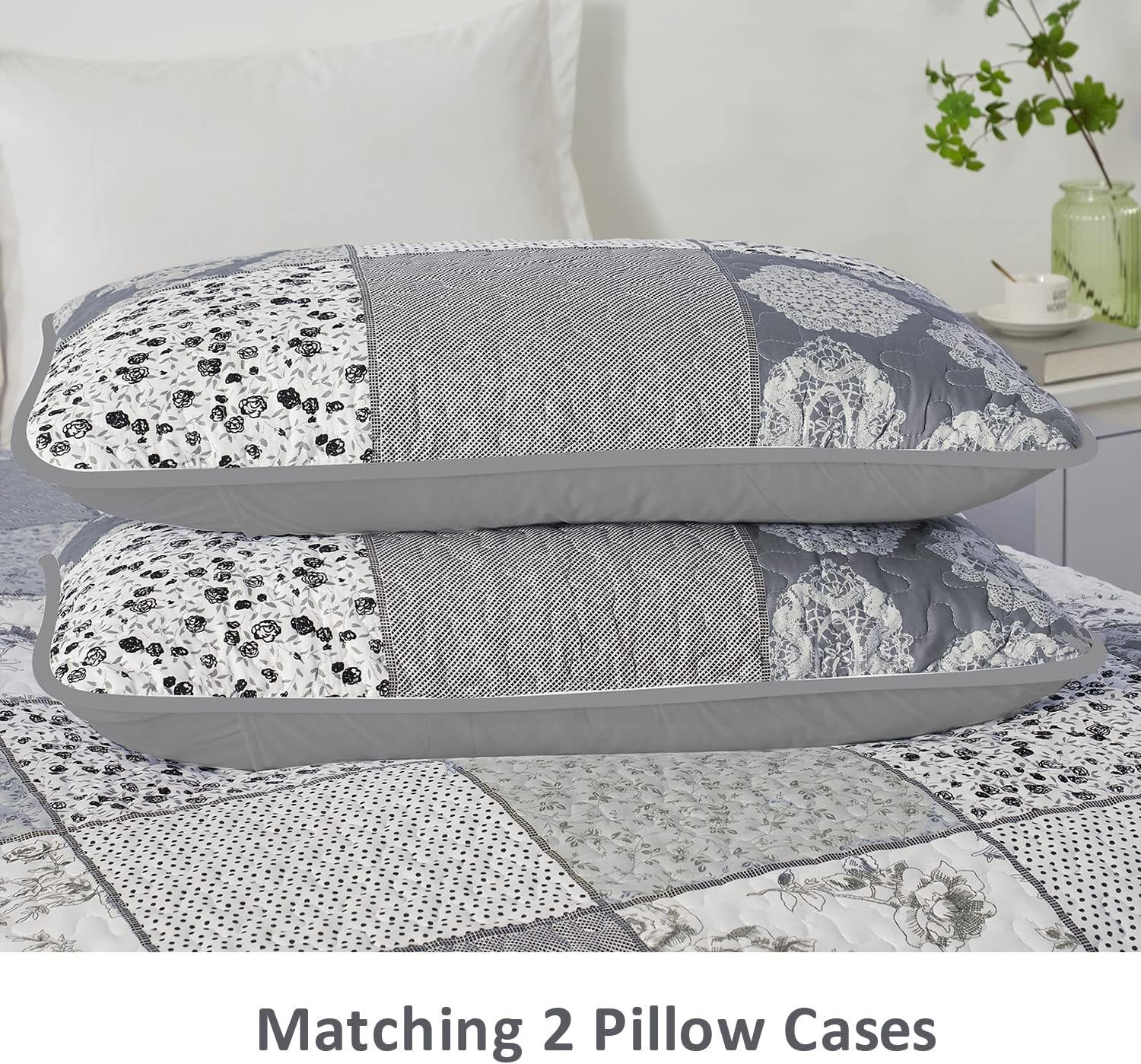 Two matching pillowcases with blue and white patchwork floral squares and stripes