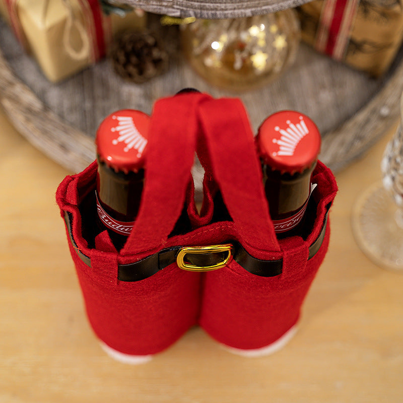 Red felt pants tote with black belt strap and yellow buckle, holding two bottles.