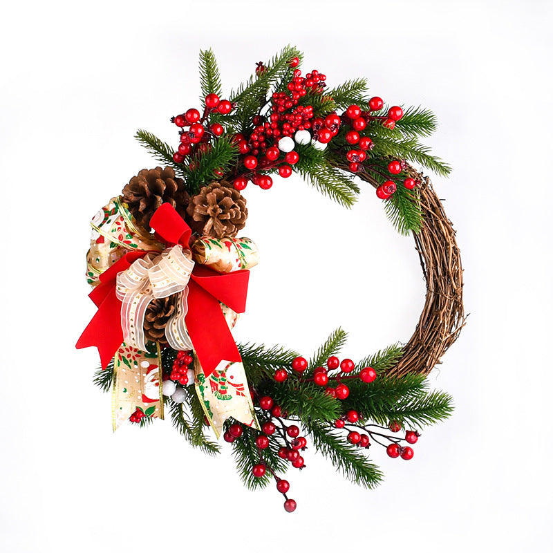 Christmas wreath with pine branches, red berries, pinecones, and red bow