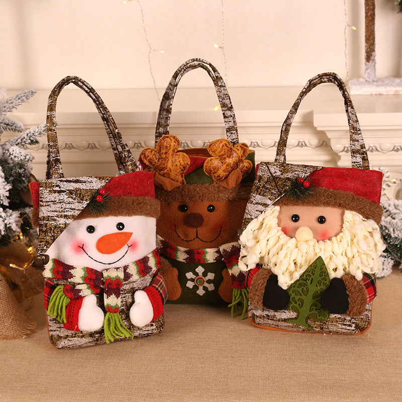 Set of Christmas gift bags: Santa, snowman, and reindeer, each with rope handles