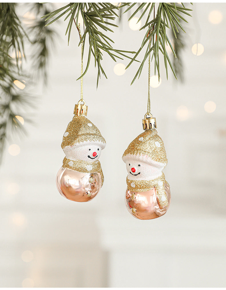 Gold and rose gold glitter snowman ornaments, two hanging on cords